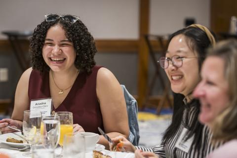 Students laughing at a table