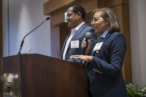 Alumni donors Jocelyn and Bob Stargel speaking at a podium