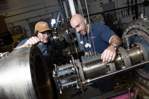 Aerospace Engineering professor Adam Steinberg works with a student in the Ben T. Zinn Combustion Laboratory.