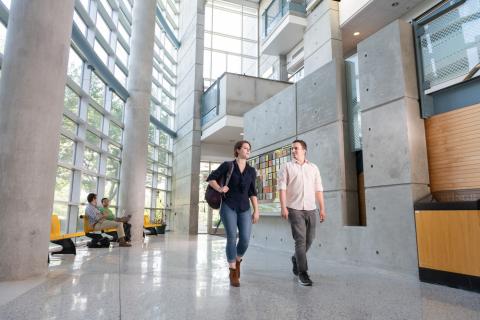 Graduate students walk through the lobby of the J. Erskine Love Jr. Manufacturing Building.