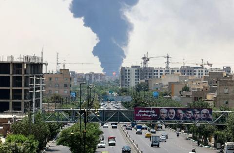 Heavy smoke and fire rise from an oil refinery in southern Tehran