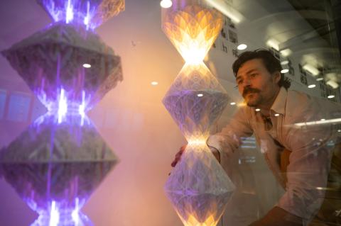 Samuel Thurman installs digitally designed and fabricated lamps in the Atlanta airport